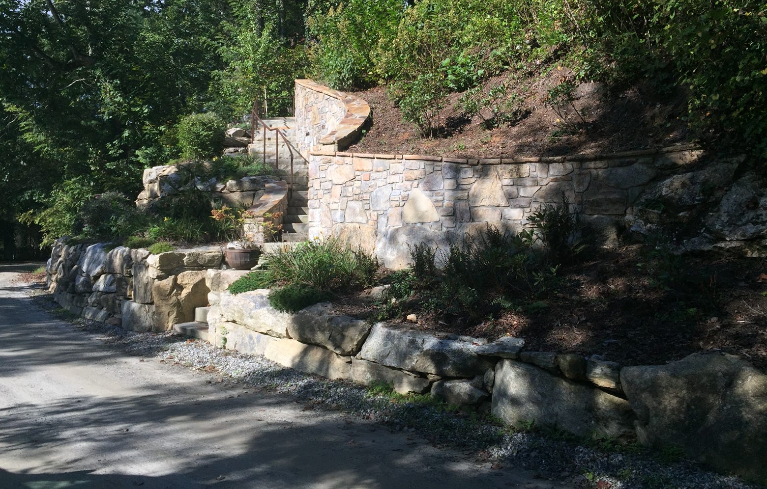 terraced pollenator garden with stone steps and stone masonry wall lake summit nc 